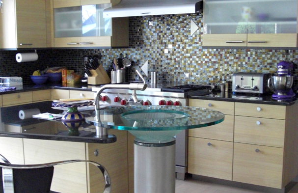 This kitchen is very simple, but has a lot of subtle detail including a floating kitchen basin with a mounted extended faucet